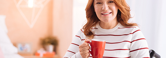 woman holding red cup