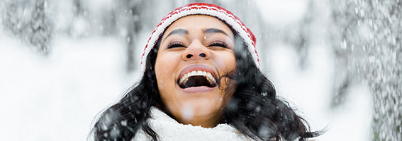 smiling woman in snow